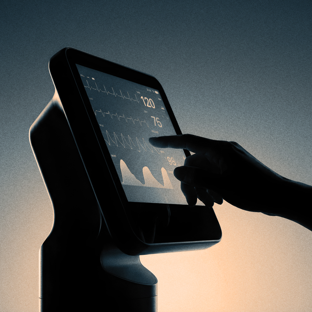 A hand touching a sleek touch screen display